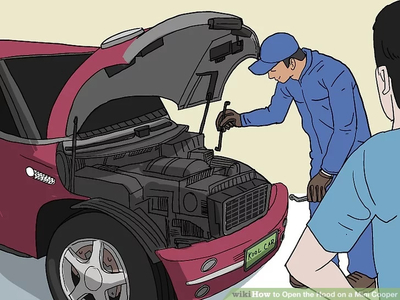 Car mechanic opening up the hood of the engine
